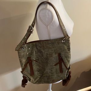 Chez purse of animal print with solid tan leather accents.